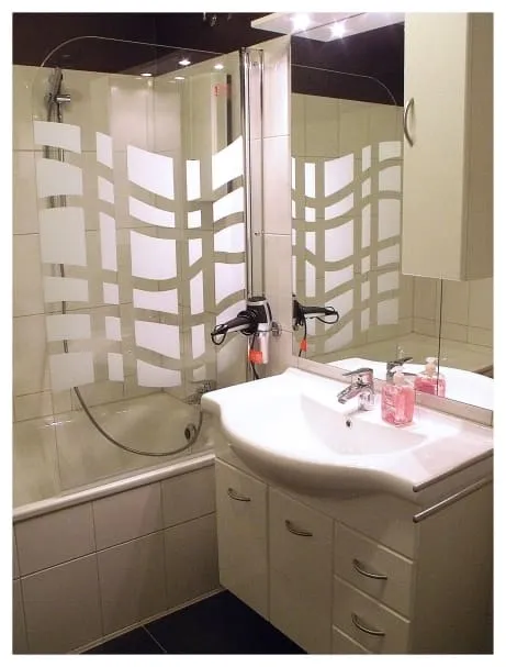 Bathroom with a tub and shower