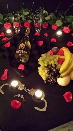 Champaign and Flower Arrangement in BDSM Appartment